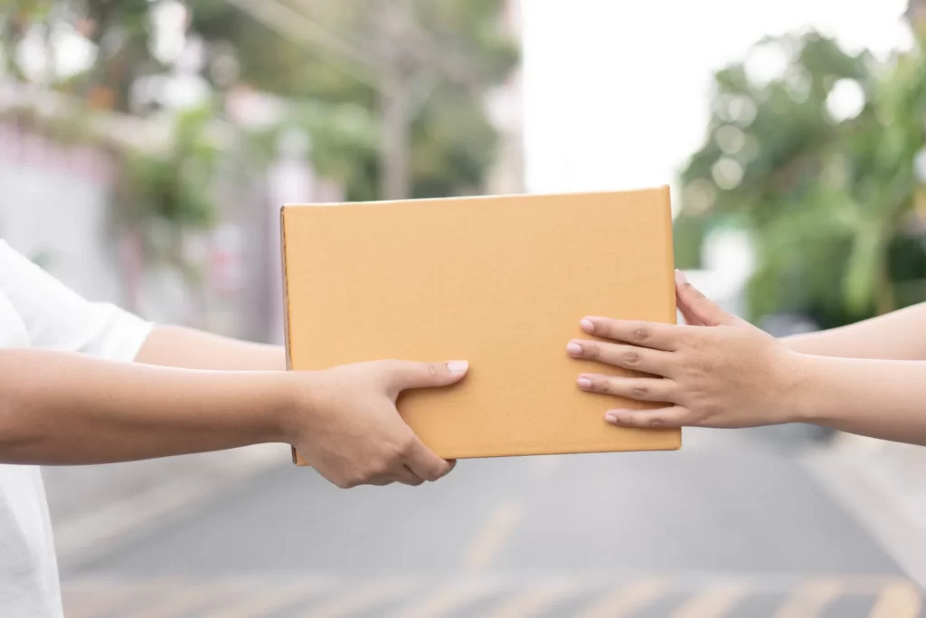 Courier handing over a package