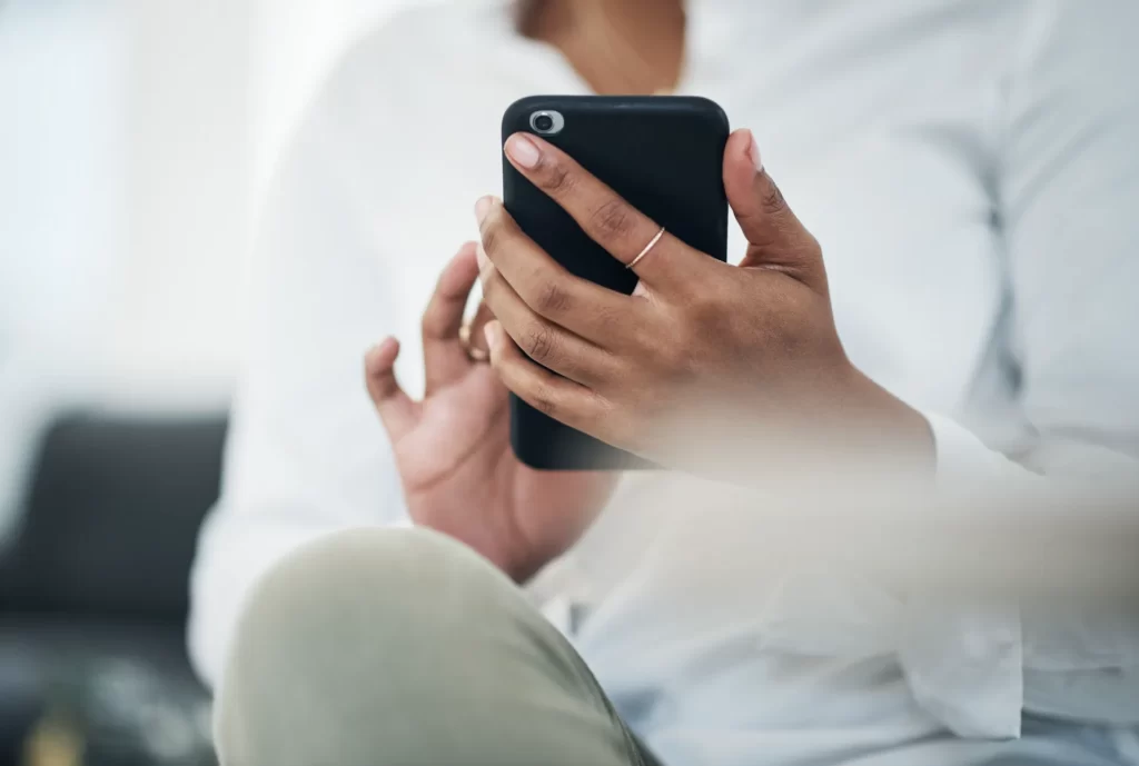 Woman using a smartphone in a relaxed setting